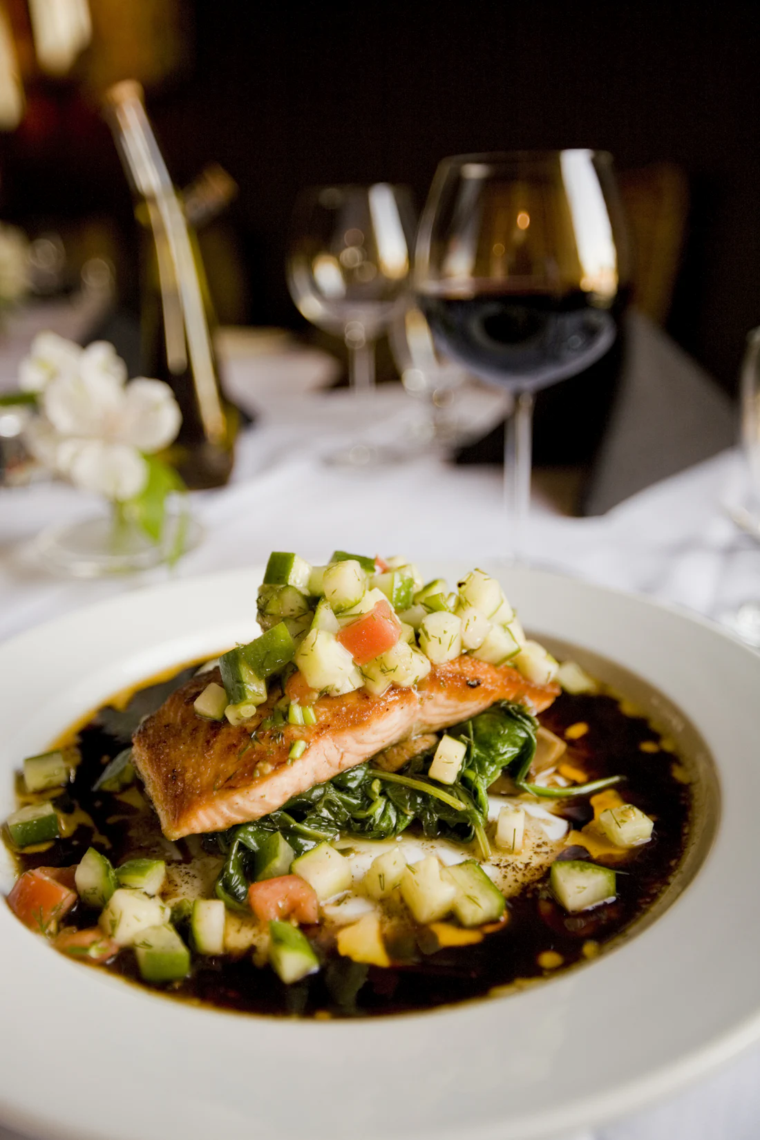 A plated dish on white linen